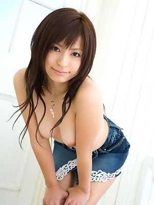 Cute Asian teen shows off her nice tits and then her hairy pussy