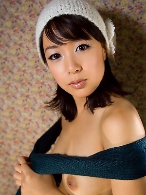 Sexy Asian teen looks great as she is showing off her firm tits and hairy pussy